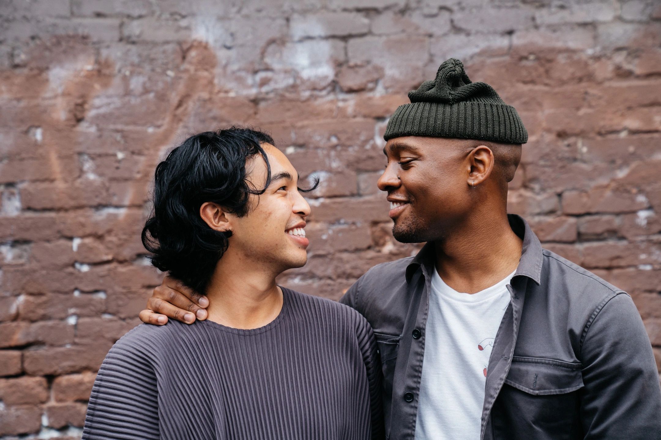 Gay couple smiling at each other