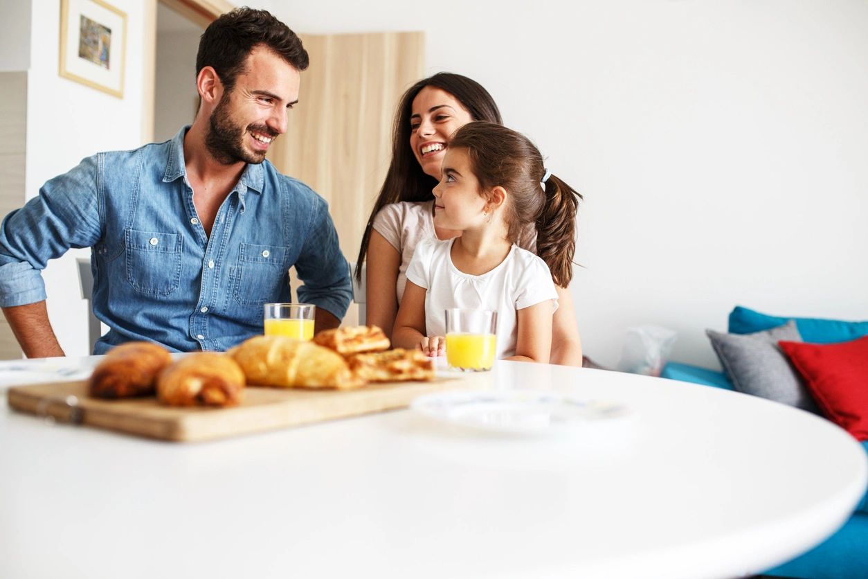 Family sitting at table talking