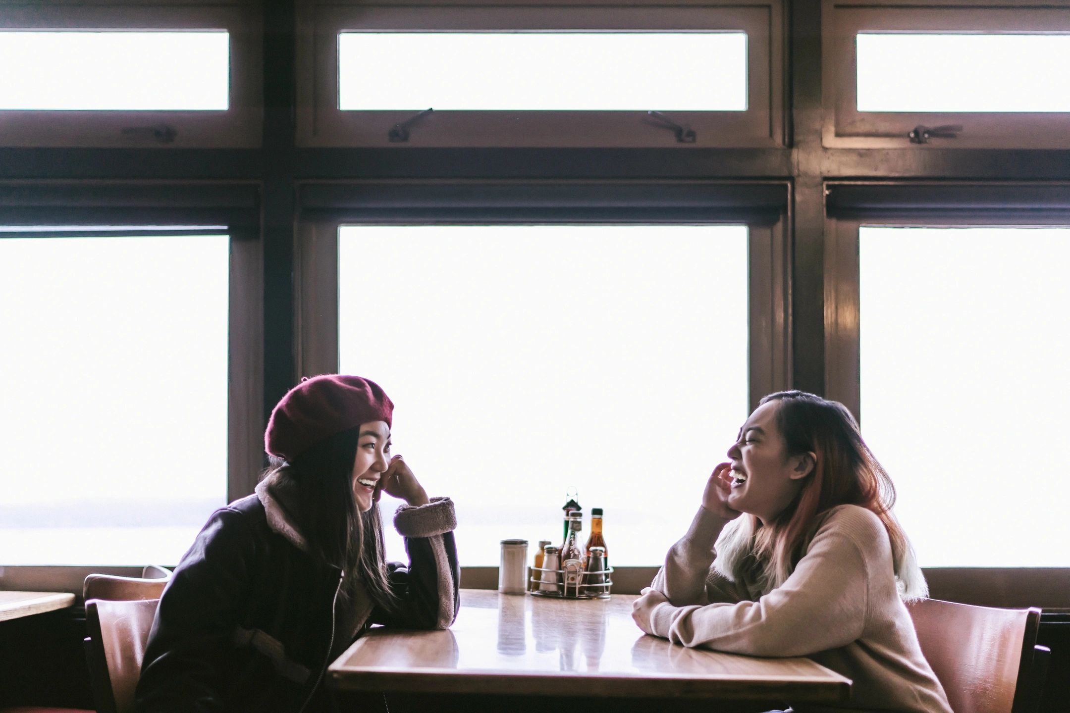 Two women looking at each other smiling